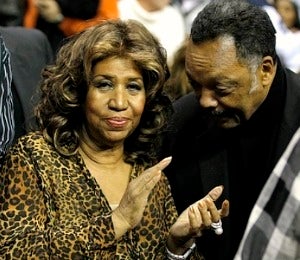 Aretha Steps Out to Pistons Game with Rev. Jackson