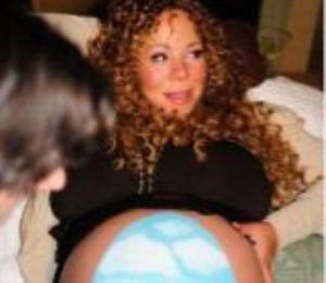 Mariah Carey Paints an Easter Egg on Belly