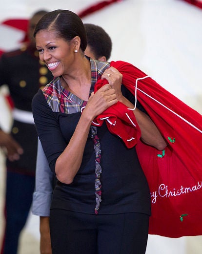First Lady Celebrates the Season of Giving, Accepts Marine's Date