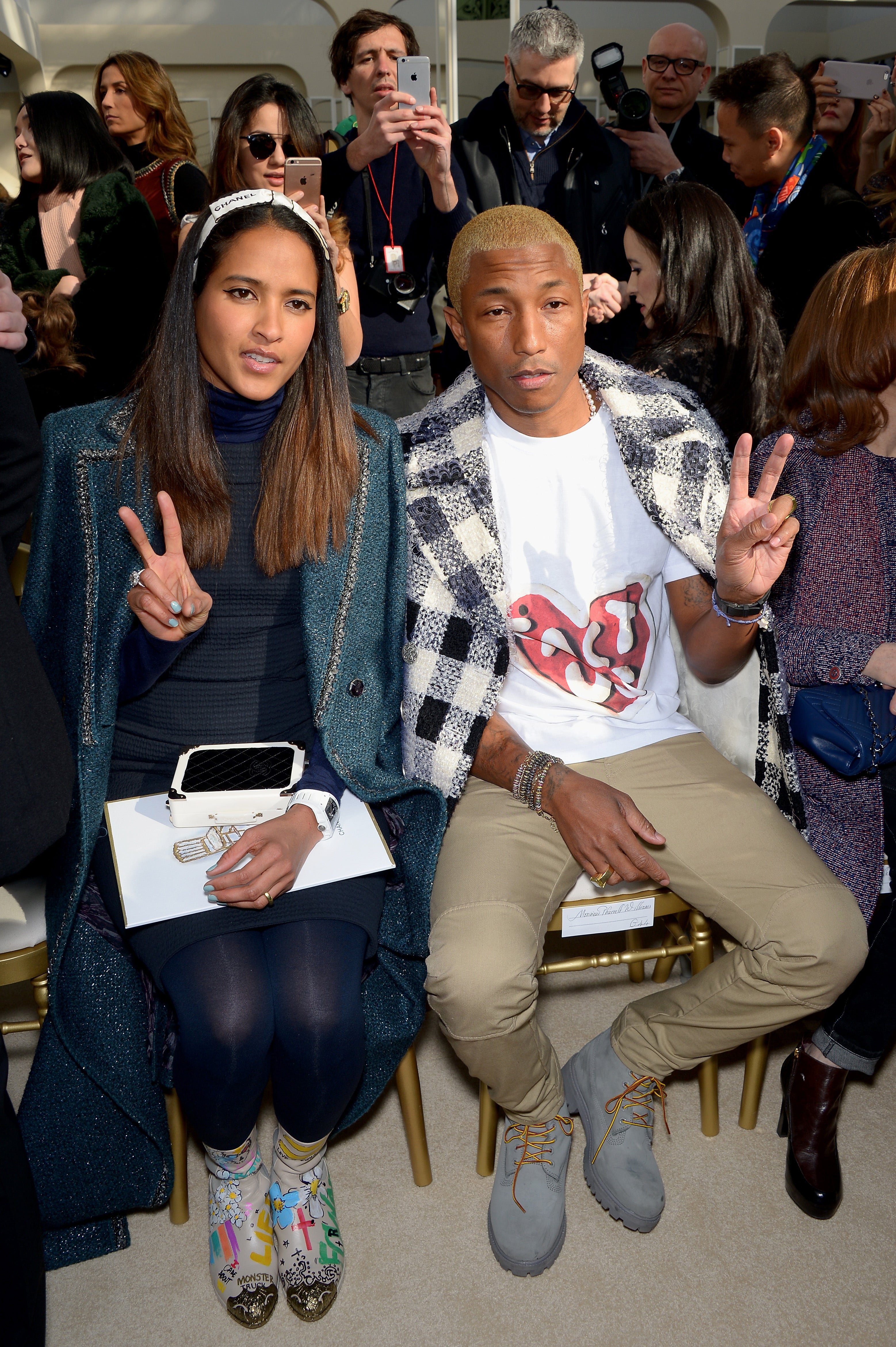 Pharrell Williams and his wife Helen Lasichanh cosy up at Chanel's