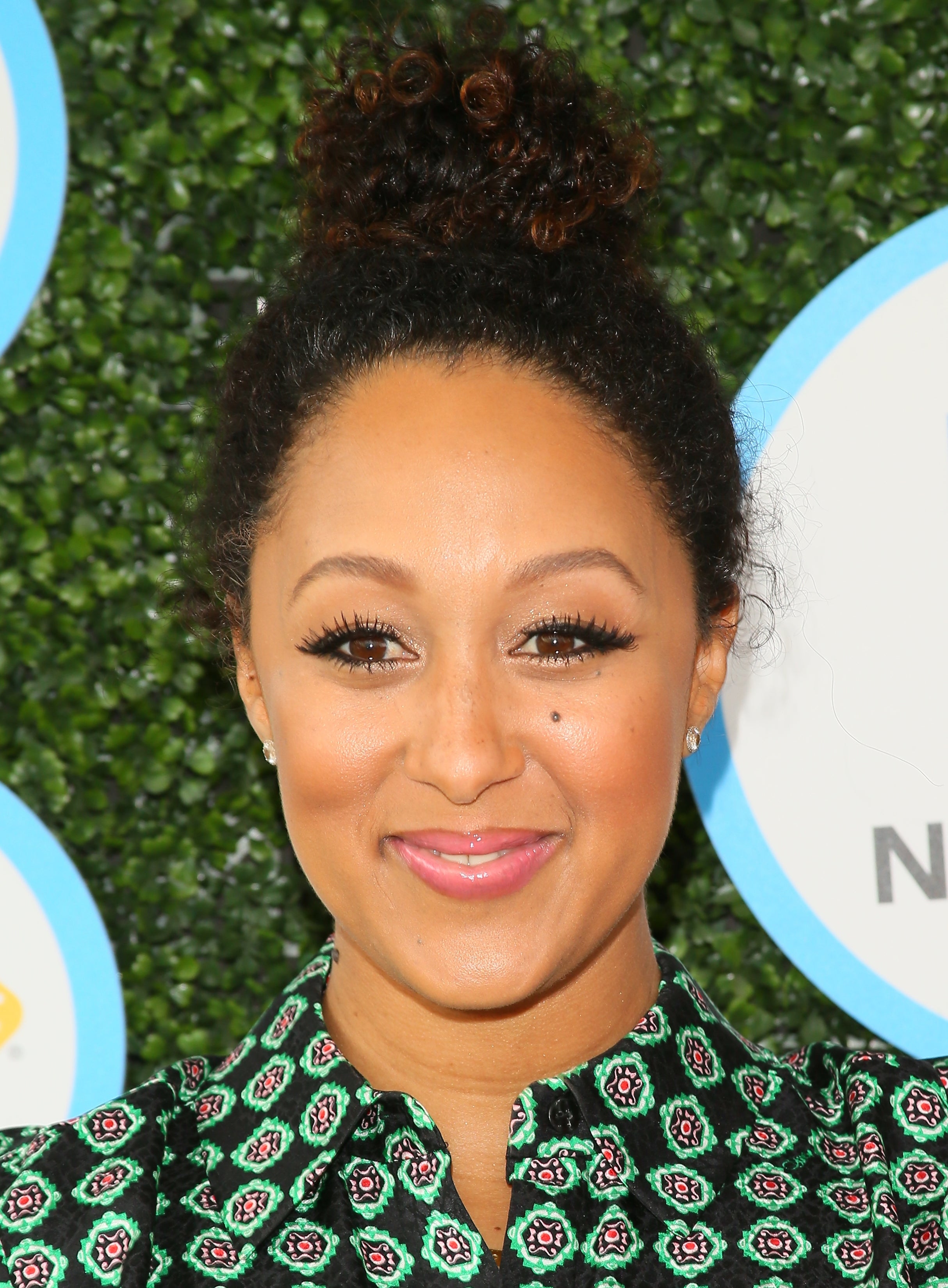 We're All in Our Feels Over Tamera Mowry-Housely’s Messy Curly Bun
