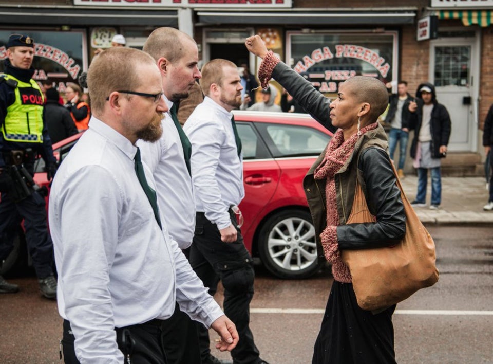 Powerful Photo of Woman Raising Black Power Fist in Front of Neo-Nazis Goes Viral