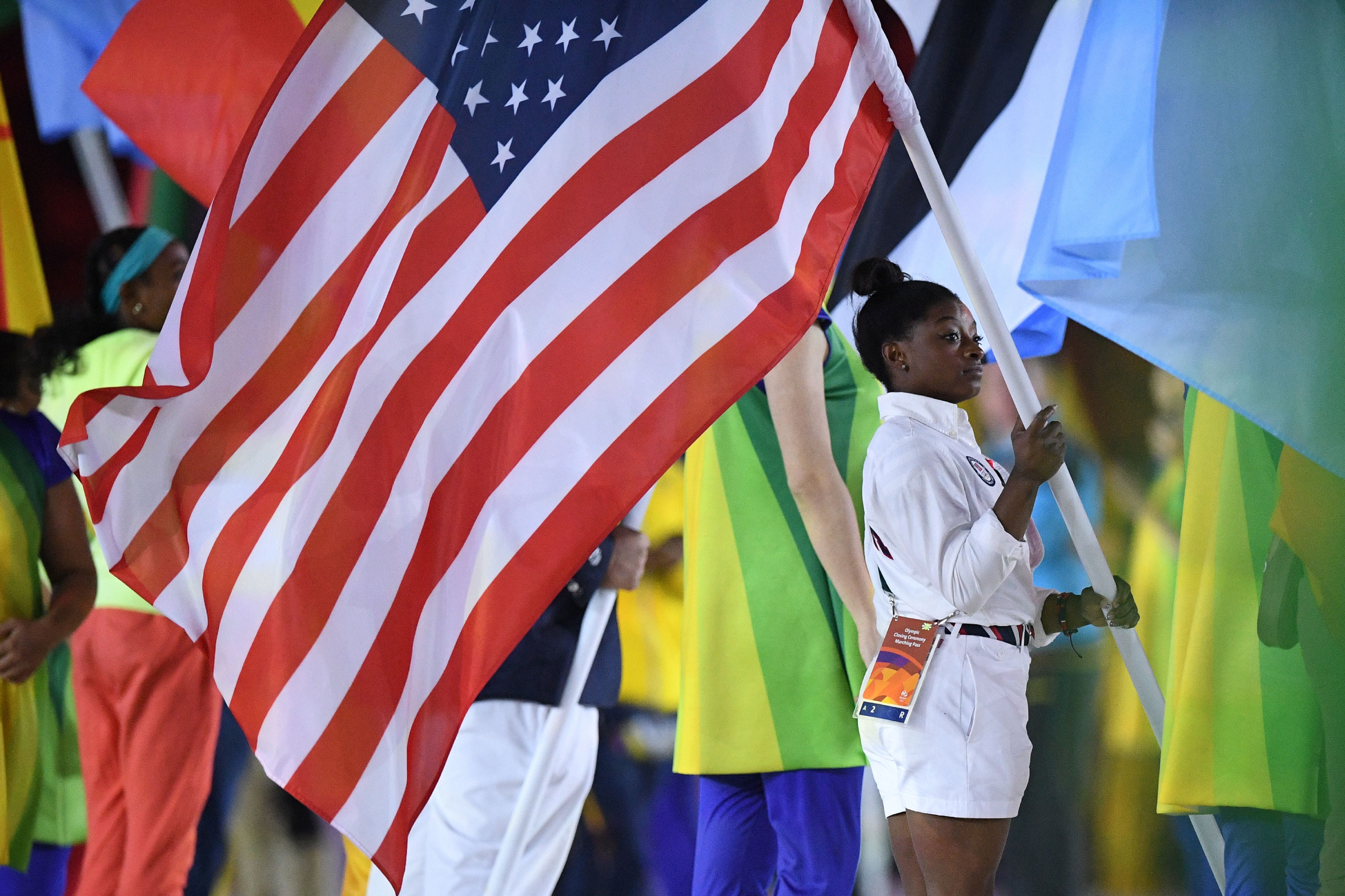 Biles Shines As First Gymnast In 80 Years To Carry US Flag 
