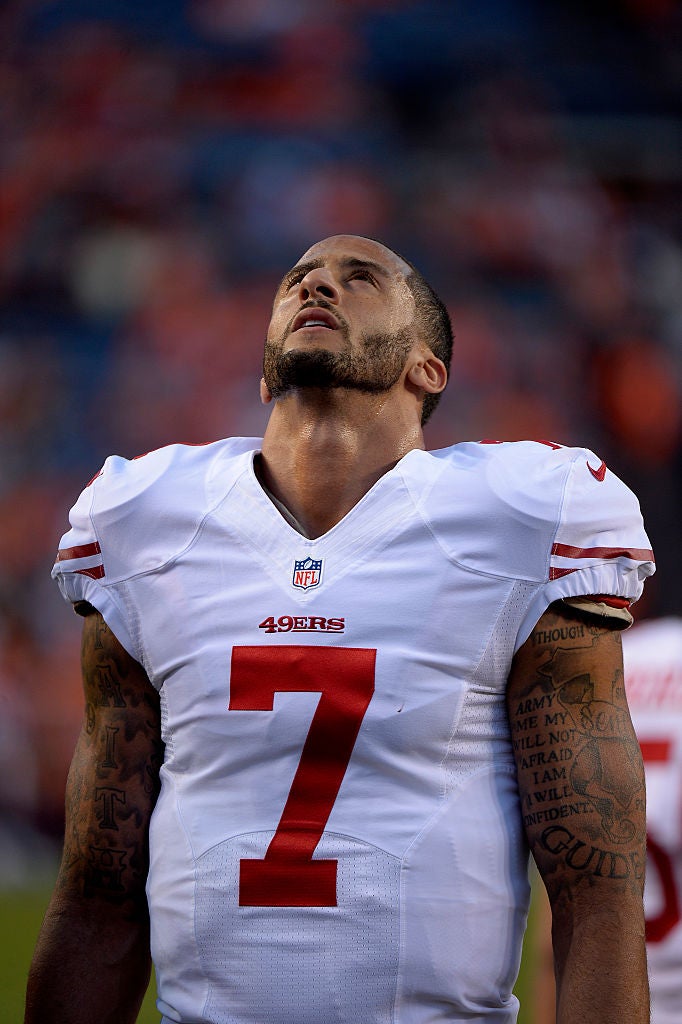 Black Student Athletes Kneel During National Anthem In Support Of Colin Kaepernick
