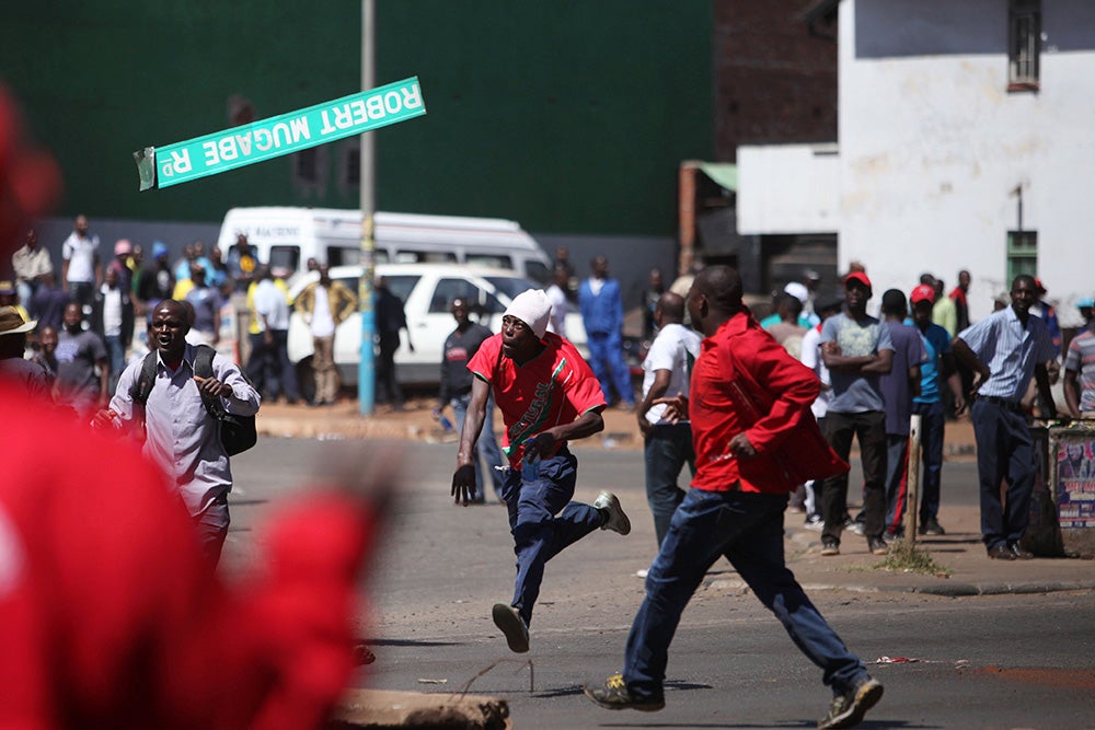18 Stirring Photos From The Anti-Government Protests In Zimbabwe 
