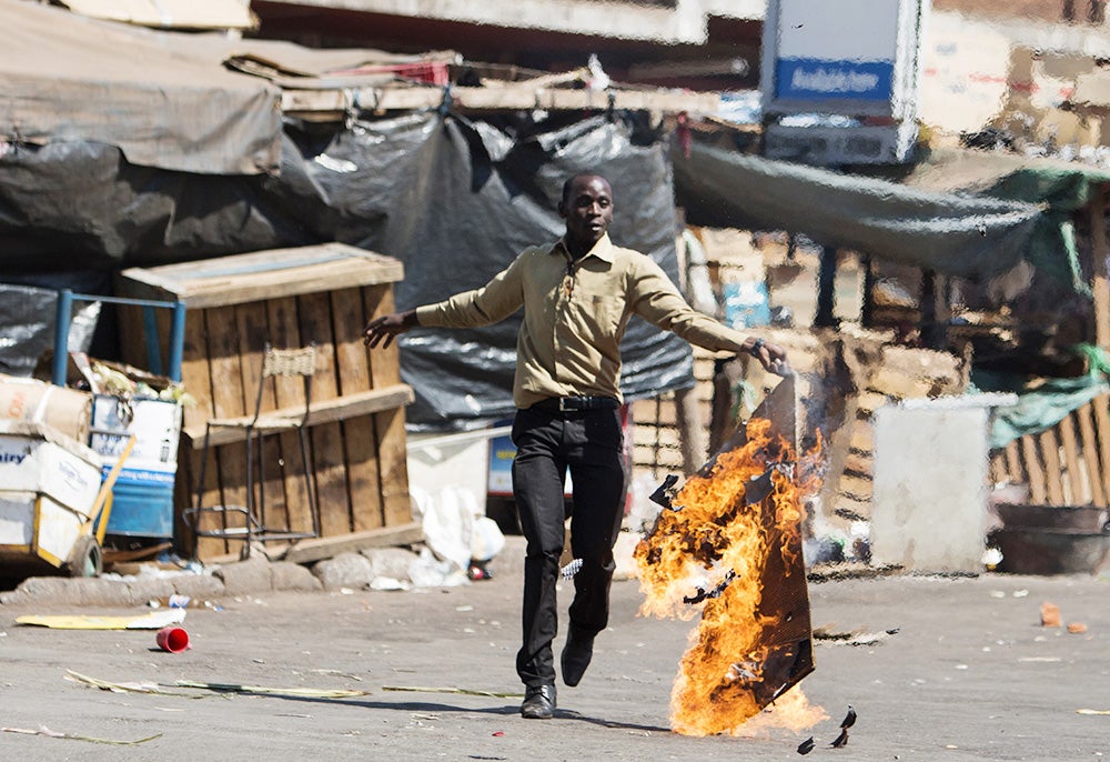 18 Stirring Photos From The Anti-Government Protests In Zimbabwe 
