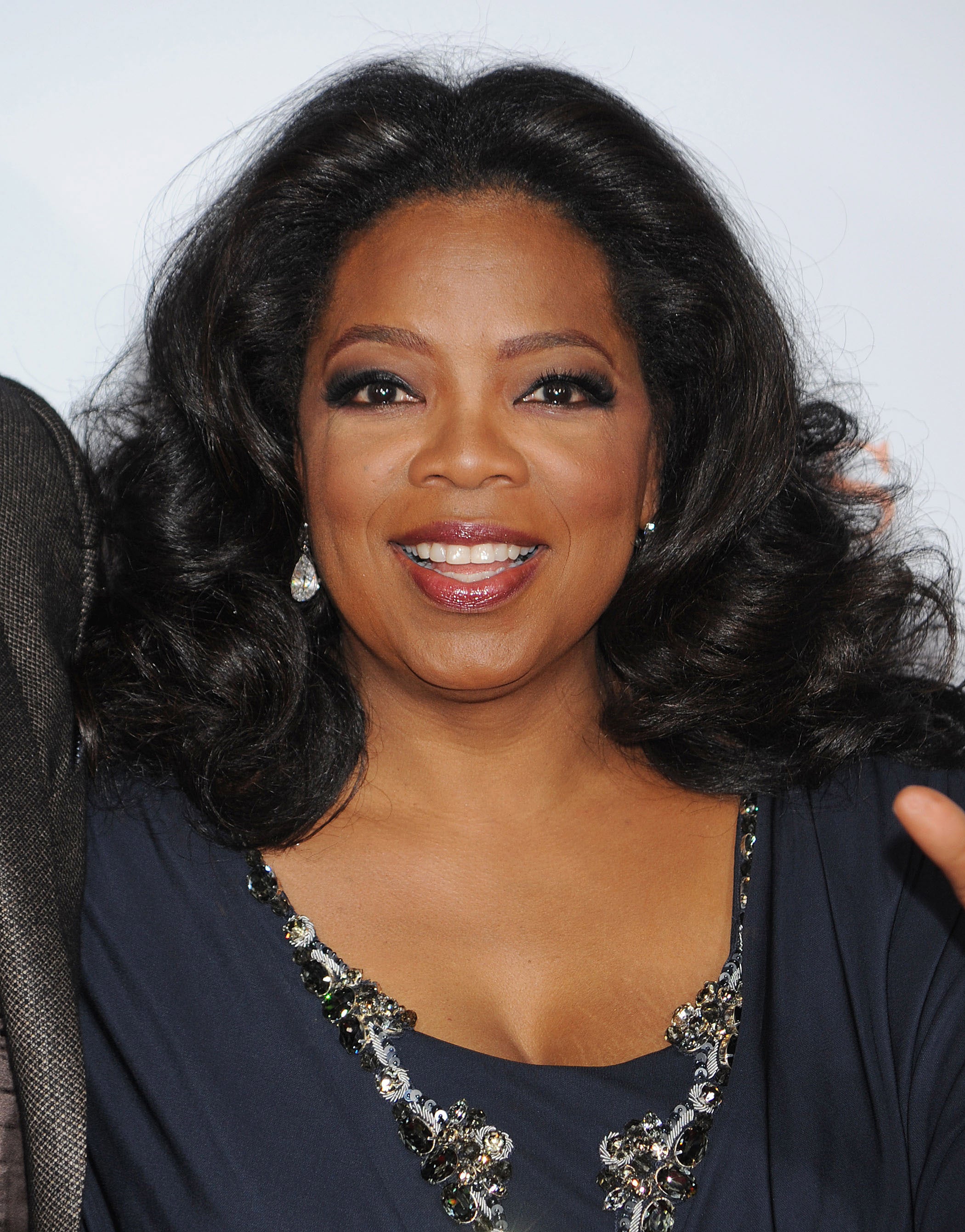 A Look Back At Oprah Winfrey's Legendary Hair Journey 
