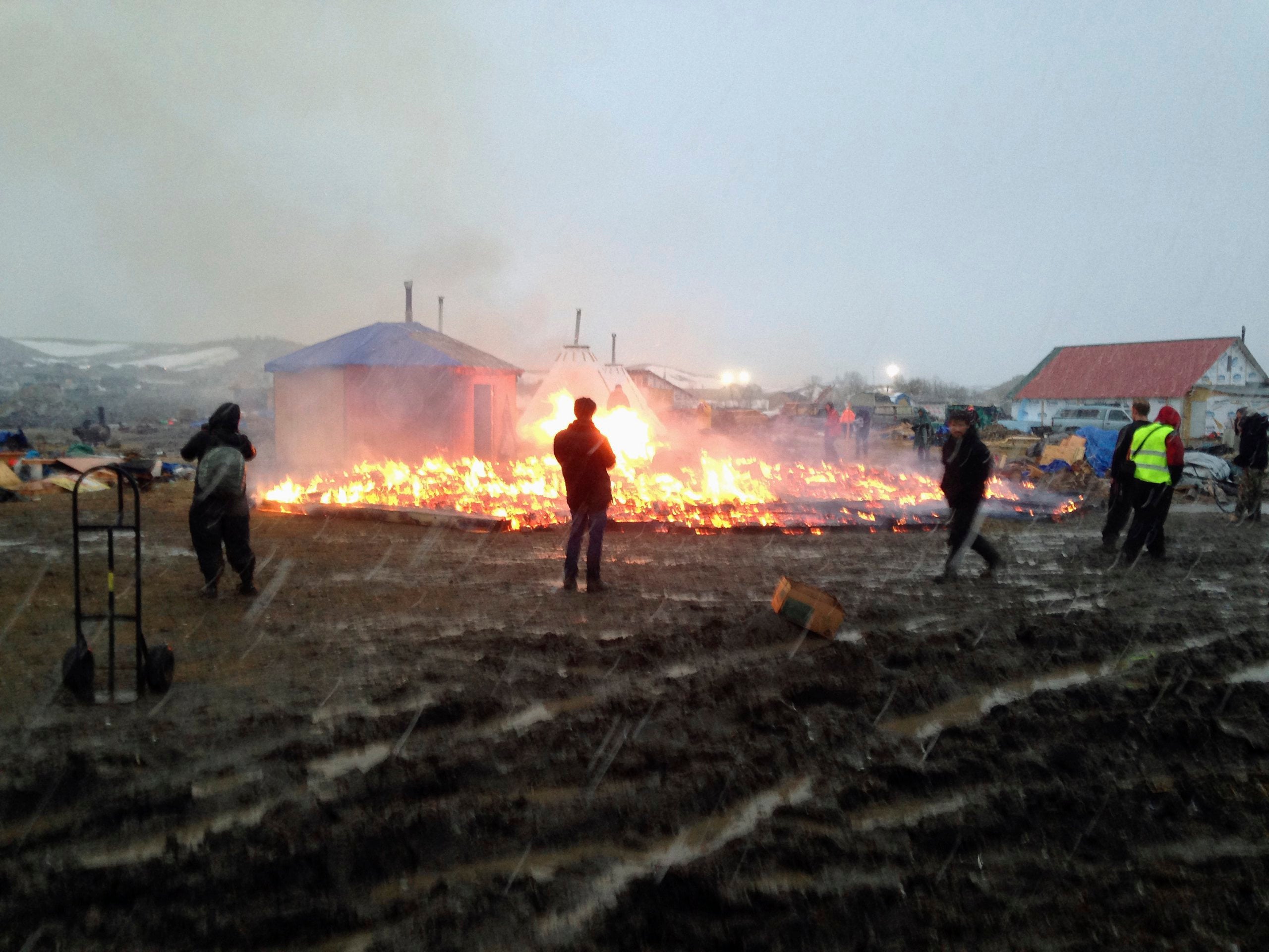 Protesters Pray And Set Fire At Dakota Access Pipeline Camp Ahead Of Shutdown