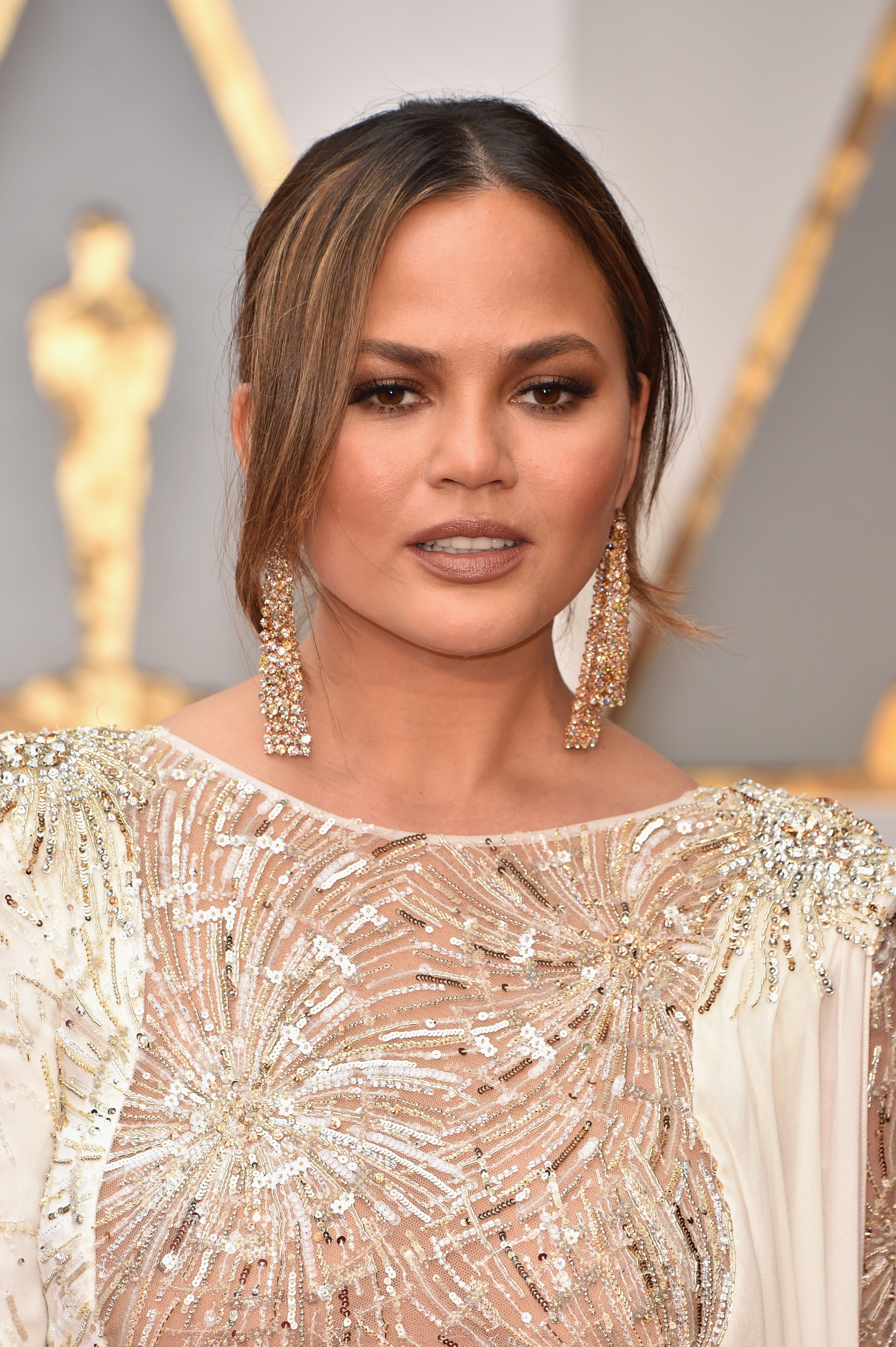 Chrissy Teigen Looks Like A Makeup Chef In This Hilarious Video Of Her Whipping Up Her Becca Palette
