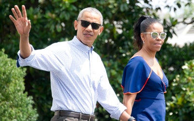 Barack And Michelle Obama Go Paddleboarding In The Caribbean