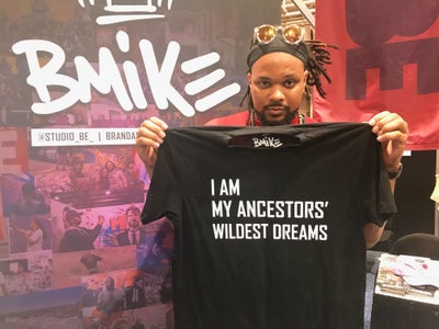 NOLA Visual Artist BMike Brings The Fight Against Injustice To Life Through His Powerful Paintings At ESSENCE Fest