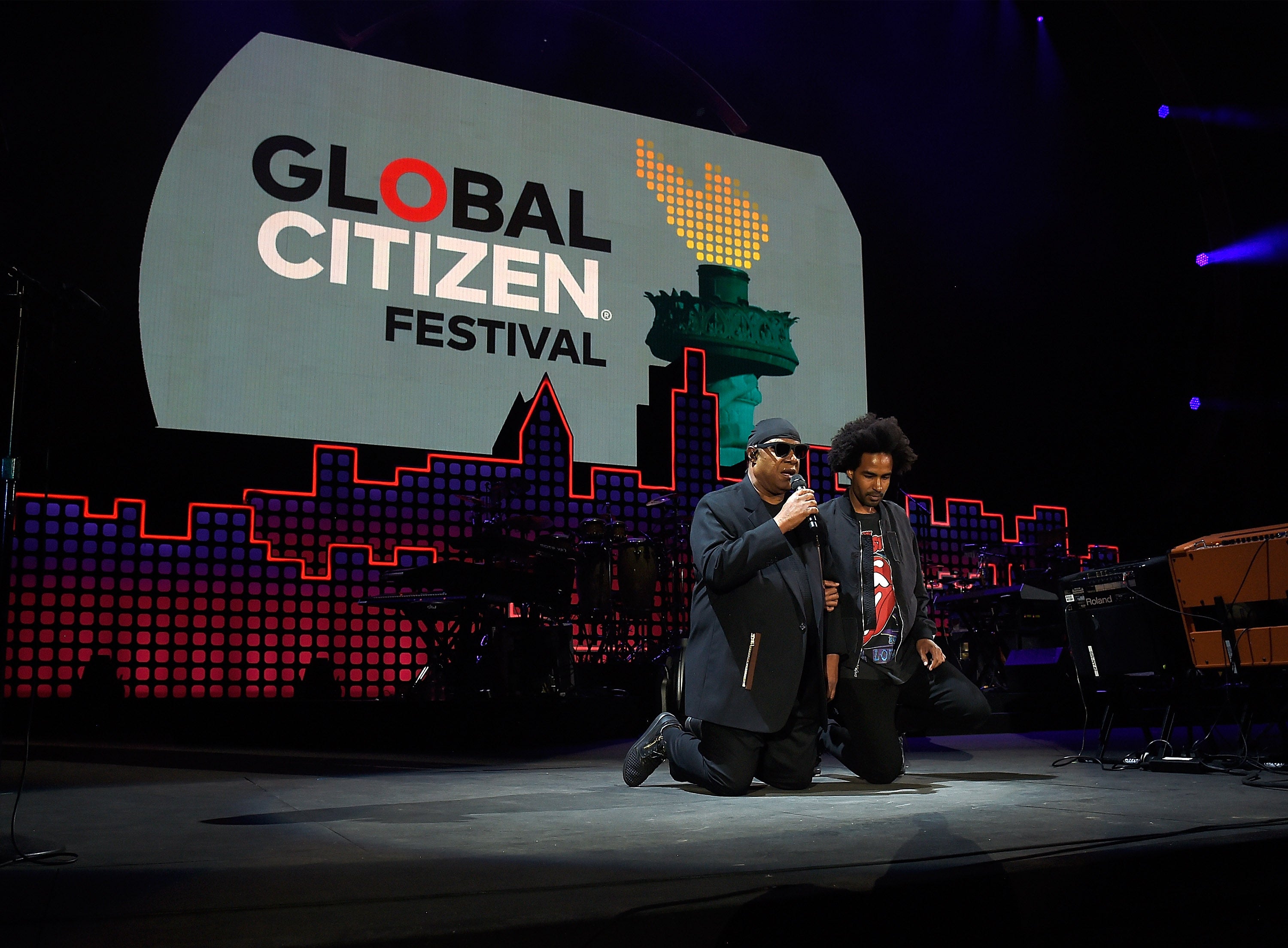 Stevie Wonder Takes A Knee During Global Citizen Fest Performance
