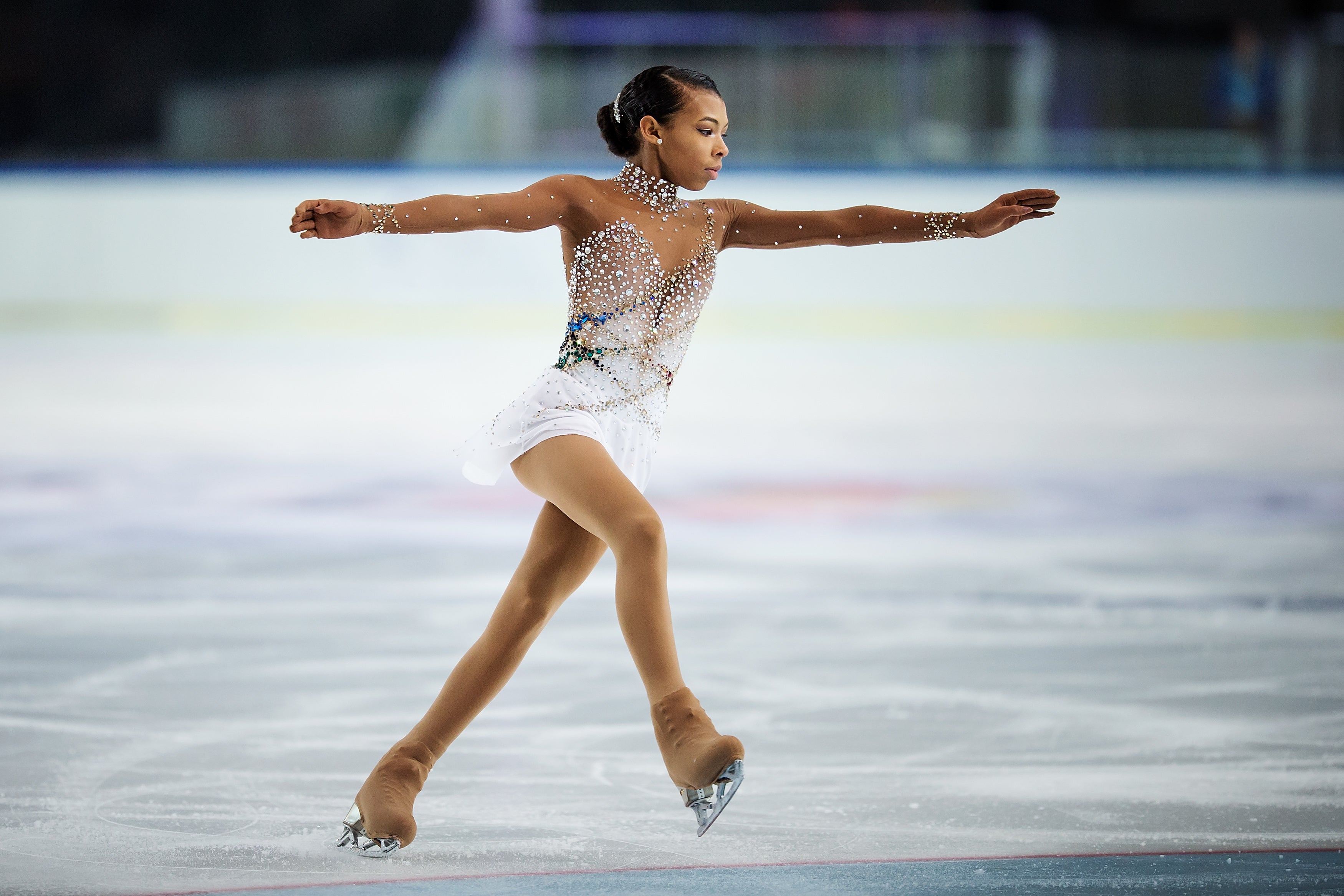 Teen Figure Skater Covers Whitney Houston’s 'One Moment In Time' During National Championship Routine
