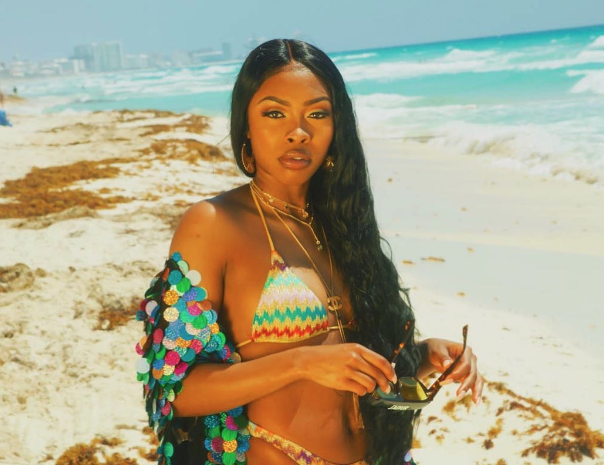 Tink Hits The Beach With ‘The Chi’ Star Barton Fitzpatrick In New Music Video For ‘M.I.A.’