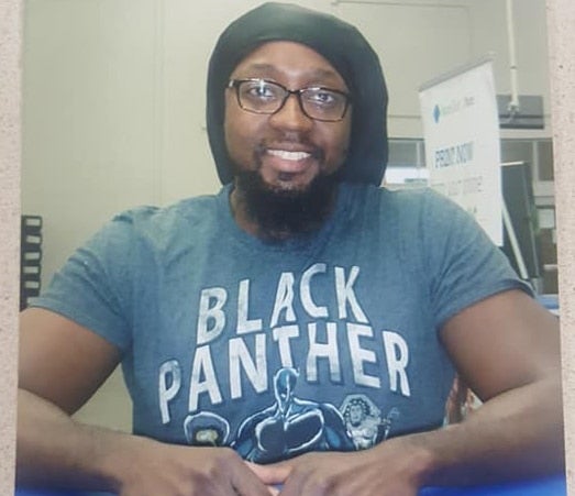Sam's Club Employee Of The Month Asked To Retake Photo After Customer Complains About 'Blank Panther' T-Shirt