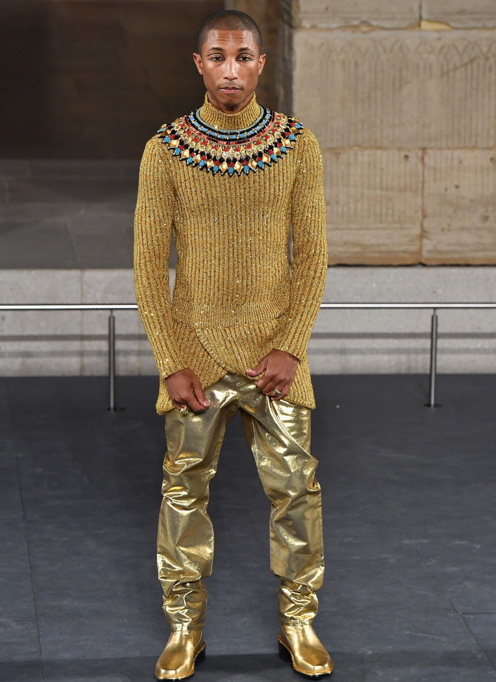 Pharrell Gleams In Gold For Chanel’s Metiers d’Art Show