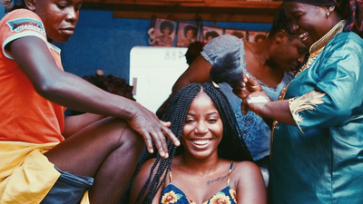 Black Travel Moment Of The Day: This Happy Traveler Getting Her Hair Braided In Kenya Is Pure Black Girl Magic