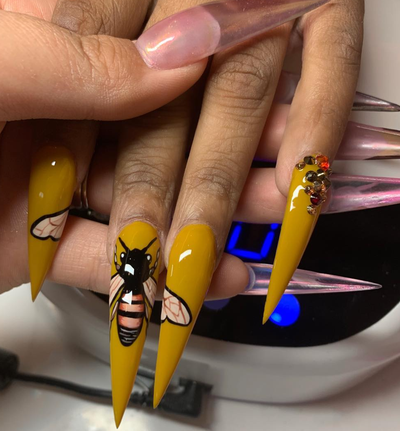 9 Reasons To Get Into Logo Nails This Spring