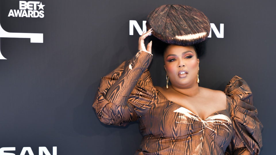 Lizzo Opted For Wood Grain And Natural Hair For Her BET Awards Look
