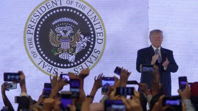 ‘45 Is A Puppet’: Trump Appears On Turning Point USA Stage In Front Of Altered Presidential Seal