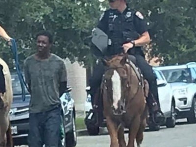 Texas Police Blasted After Mounted Officers Pictured Leading Black Man By Leash