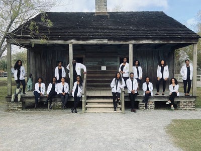 #BlackExcellence: Viral Photo Shows Black Medical Students Posed In Front Of Former Slave Quarters