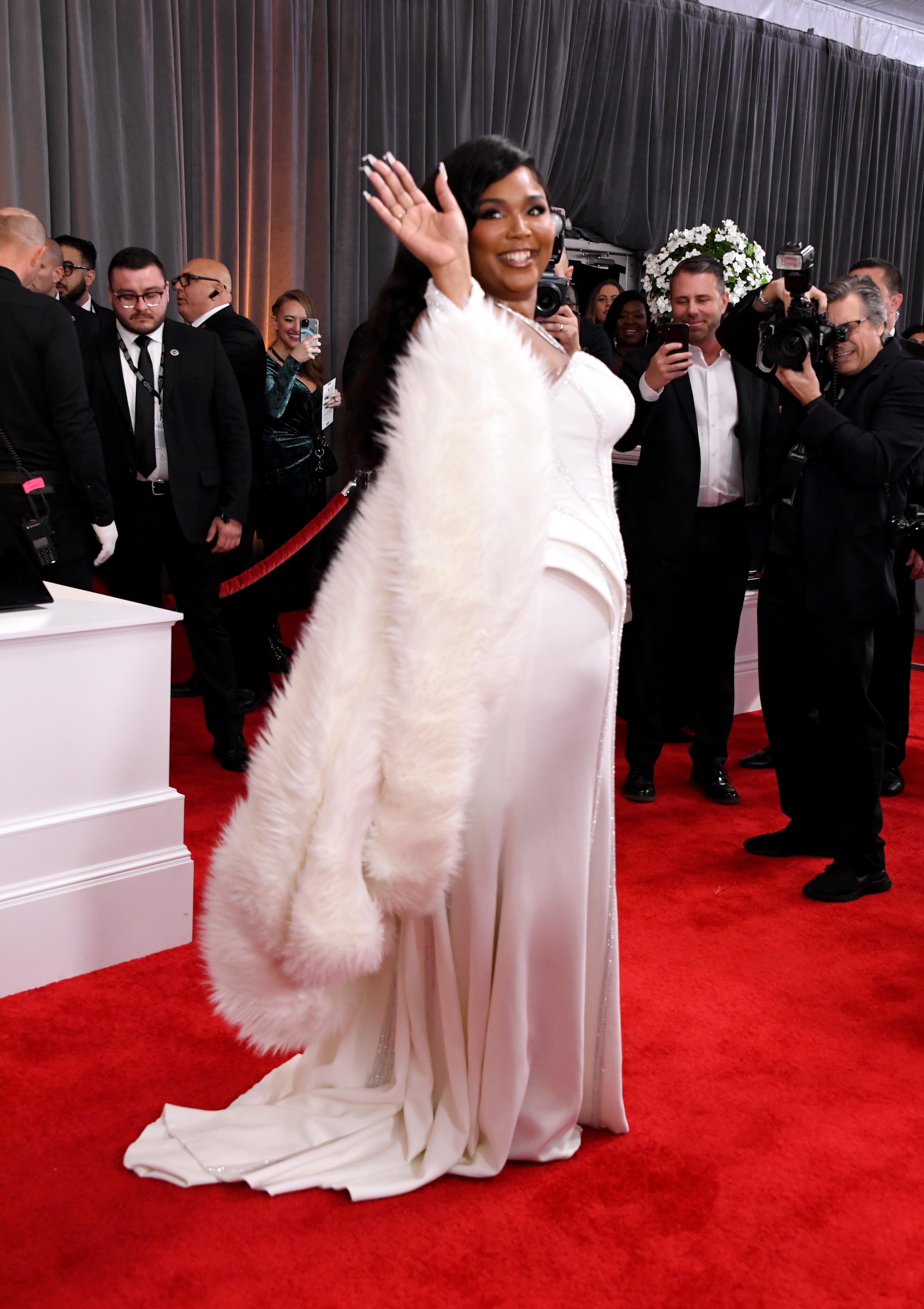 Lizzo Sports Sleek Versace Gown On The Grammys Red Carpet