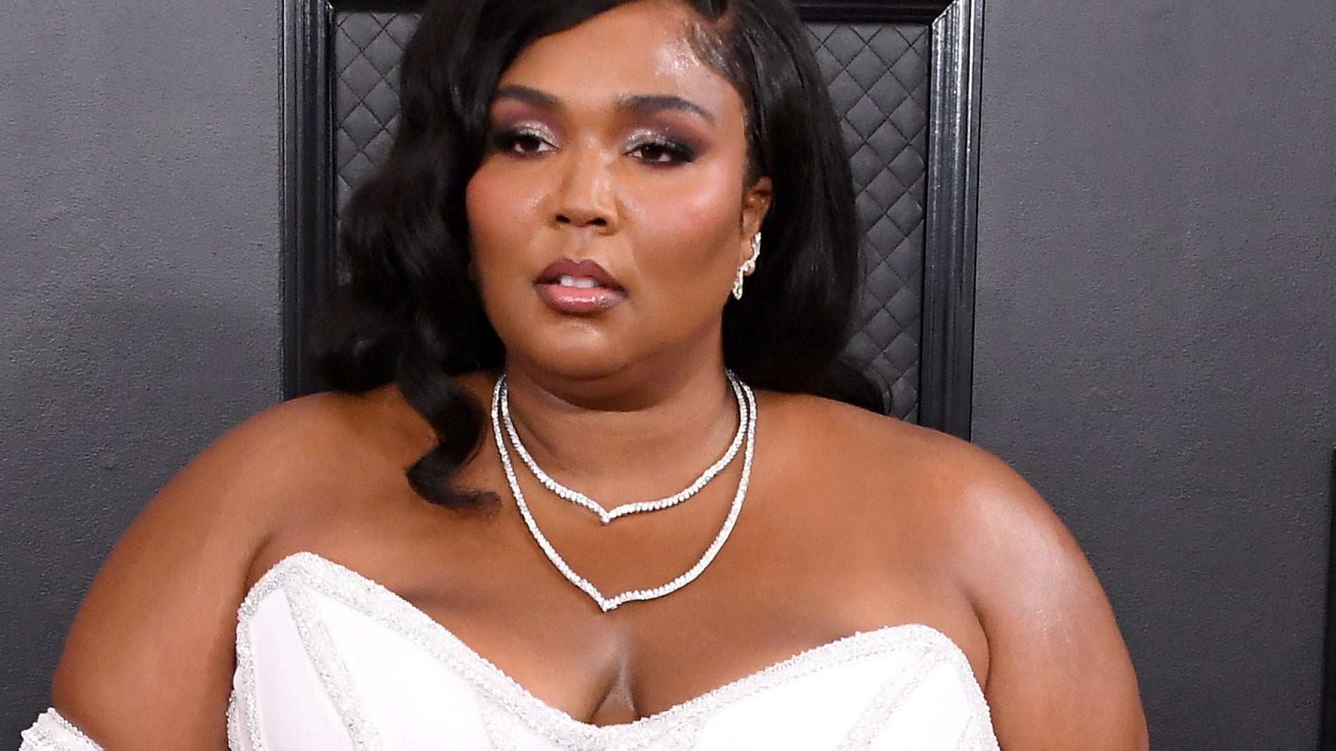 Lizzo Sports Sleek Versace Gown On The Grammy's Red Carpet