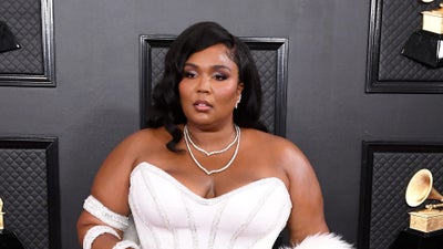 Lizzo Sports Sleek Versace Gown On The Grammys Red Carpet