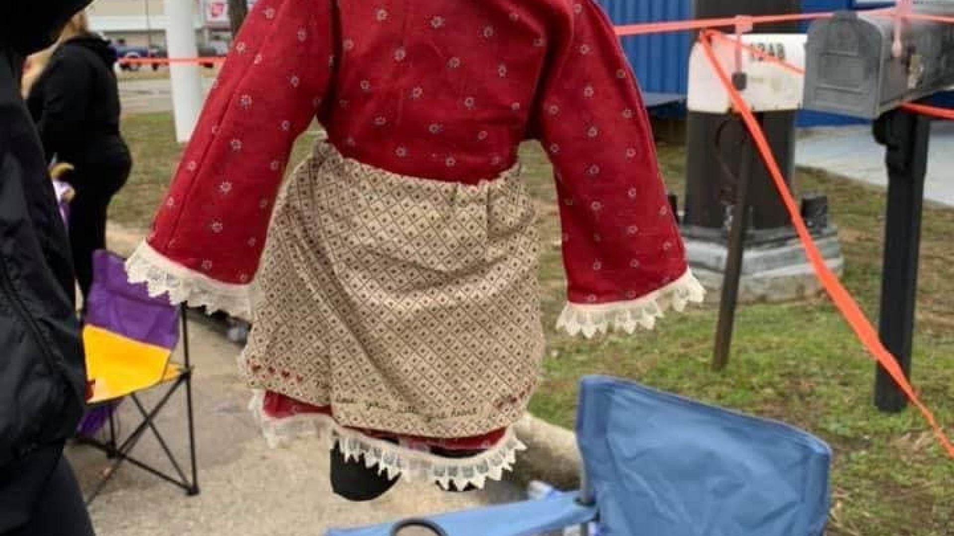 Black Doll Hanging From Noose Made Of Beads Given To Child During Mardi Gras Parade