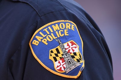 Baltimore Police Investigating After Officer Seen On Video Coughing Near Citizens