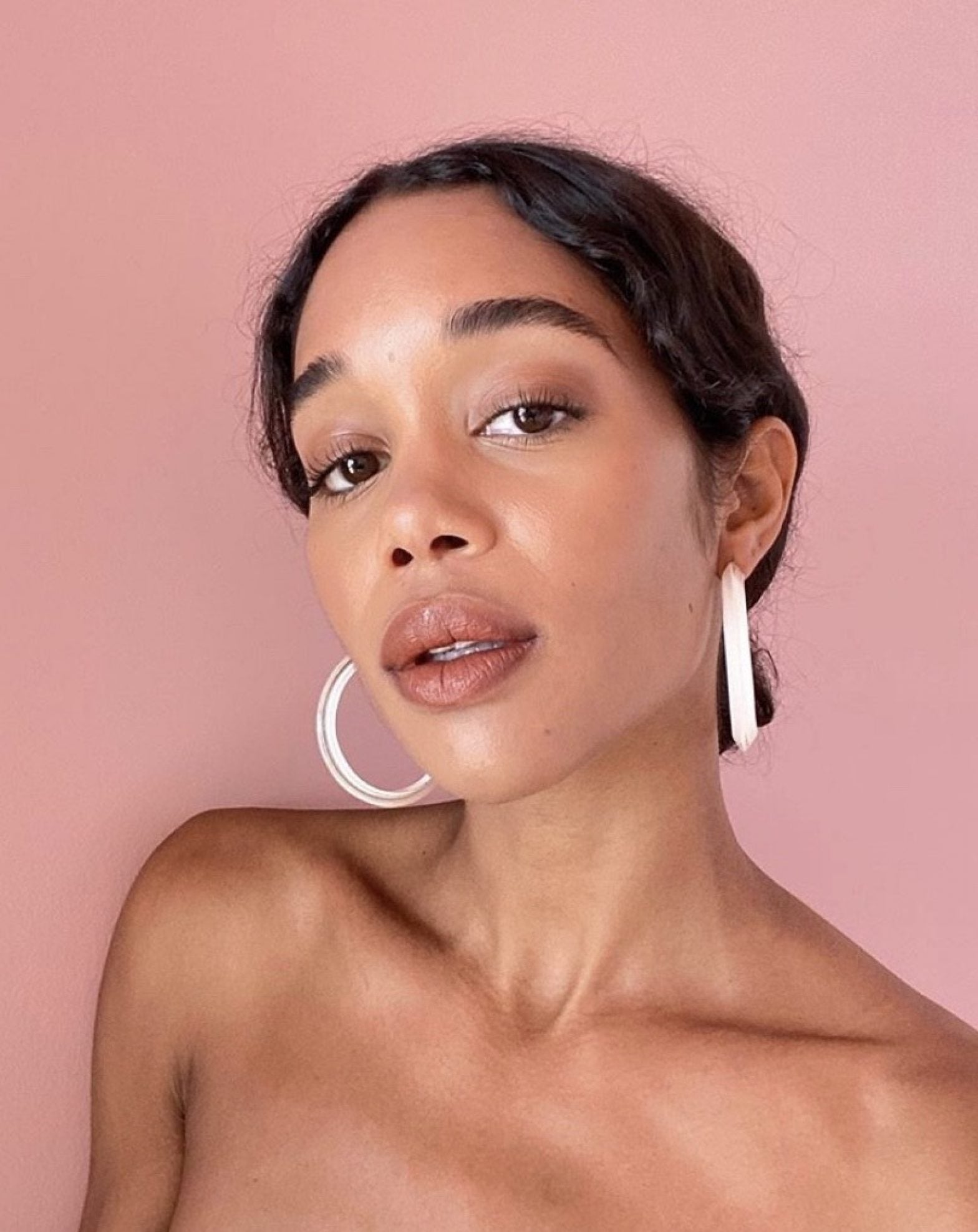 Here's The Beauty Routine Behind Laura Harrier's Flawless Skin Essence