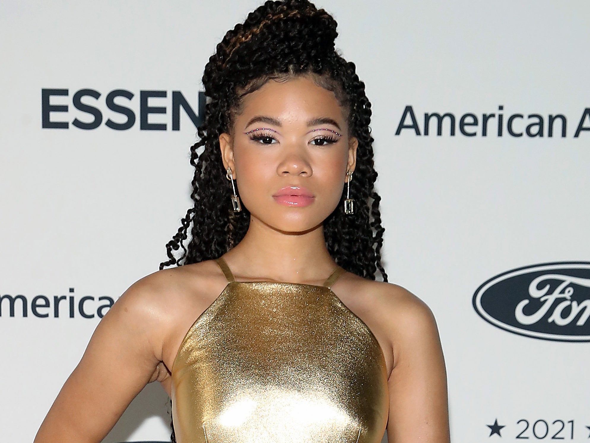 Storm Reid Was A Golden Goddess In This Custom Prada Look On The ESSENCE Red Carpet