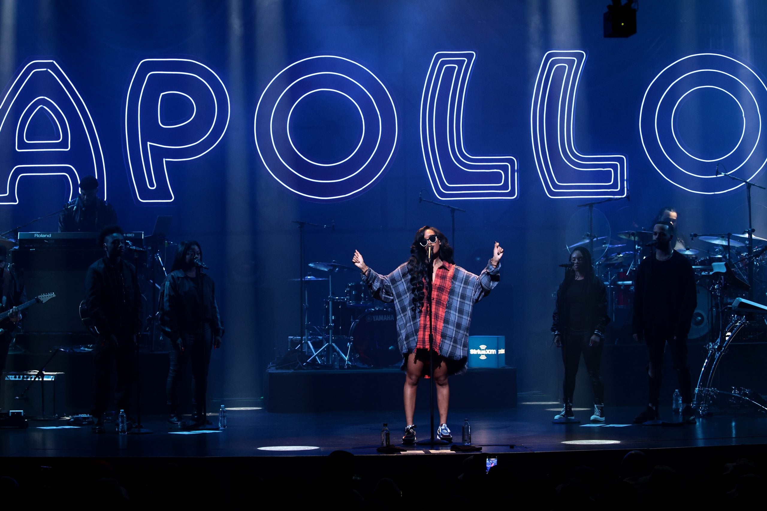 H.E.R. Headlines Apollo After Debuting There At 9 Years Old And Brings A Young Talent With Her