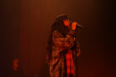 H.E.R. Headlines Apollo After Debuting There At 9 Years Old And Brings A Young Talent With Her