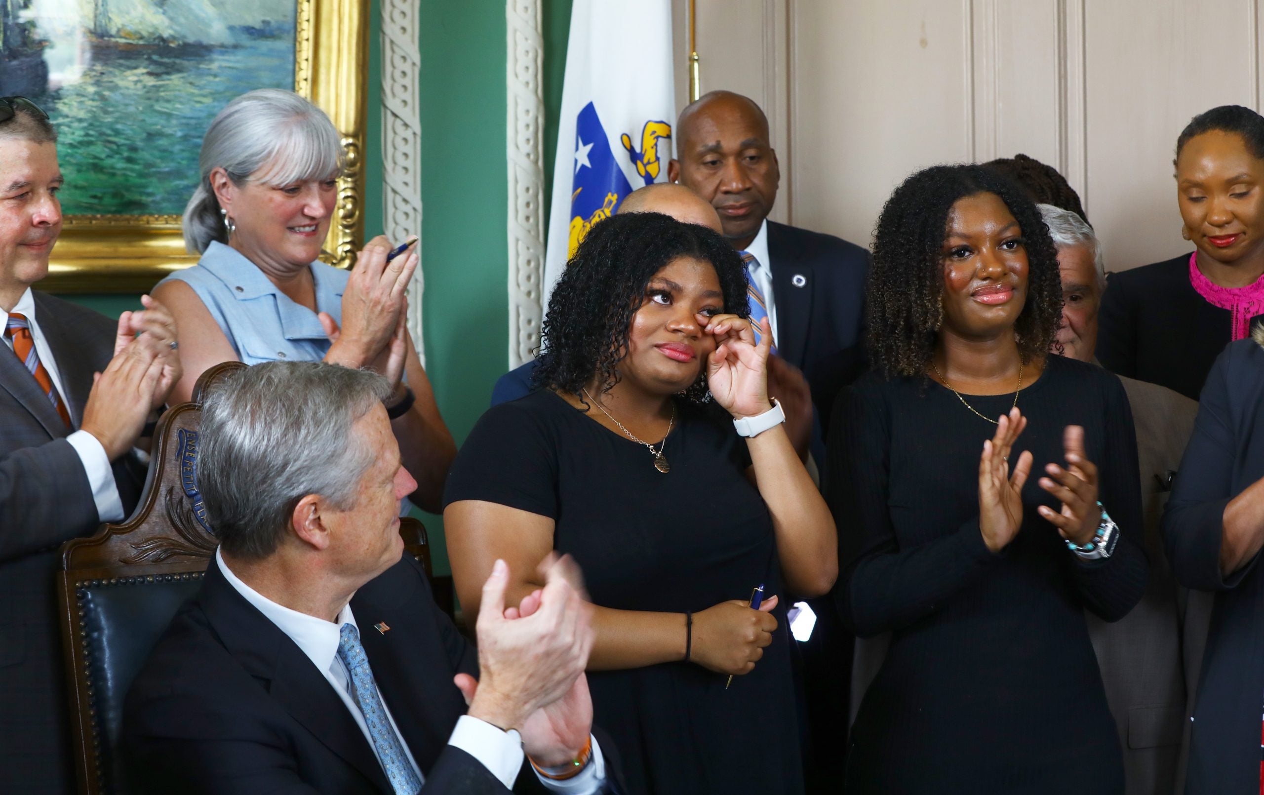 Massachusetts Signs CROWN Act, Twins Suspended For Box Braids Present At Ceremony