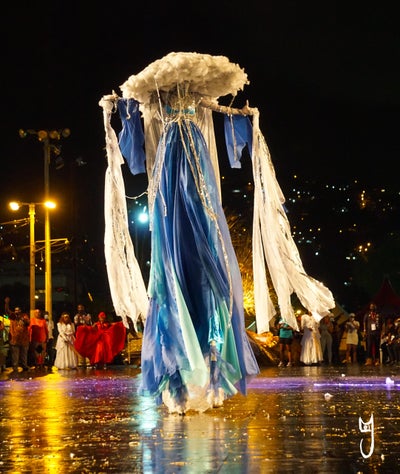 In A Crowd Of Stilt Walkers, This Queen Reigns Supreme