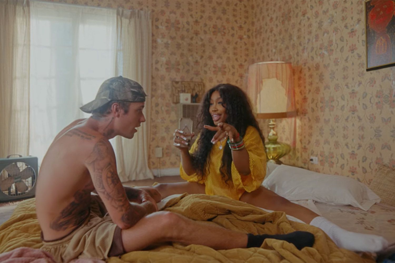 SZA Wears Vintage Versace, Mugler And More In “Snooze” Video