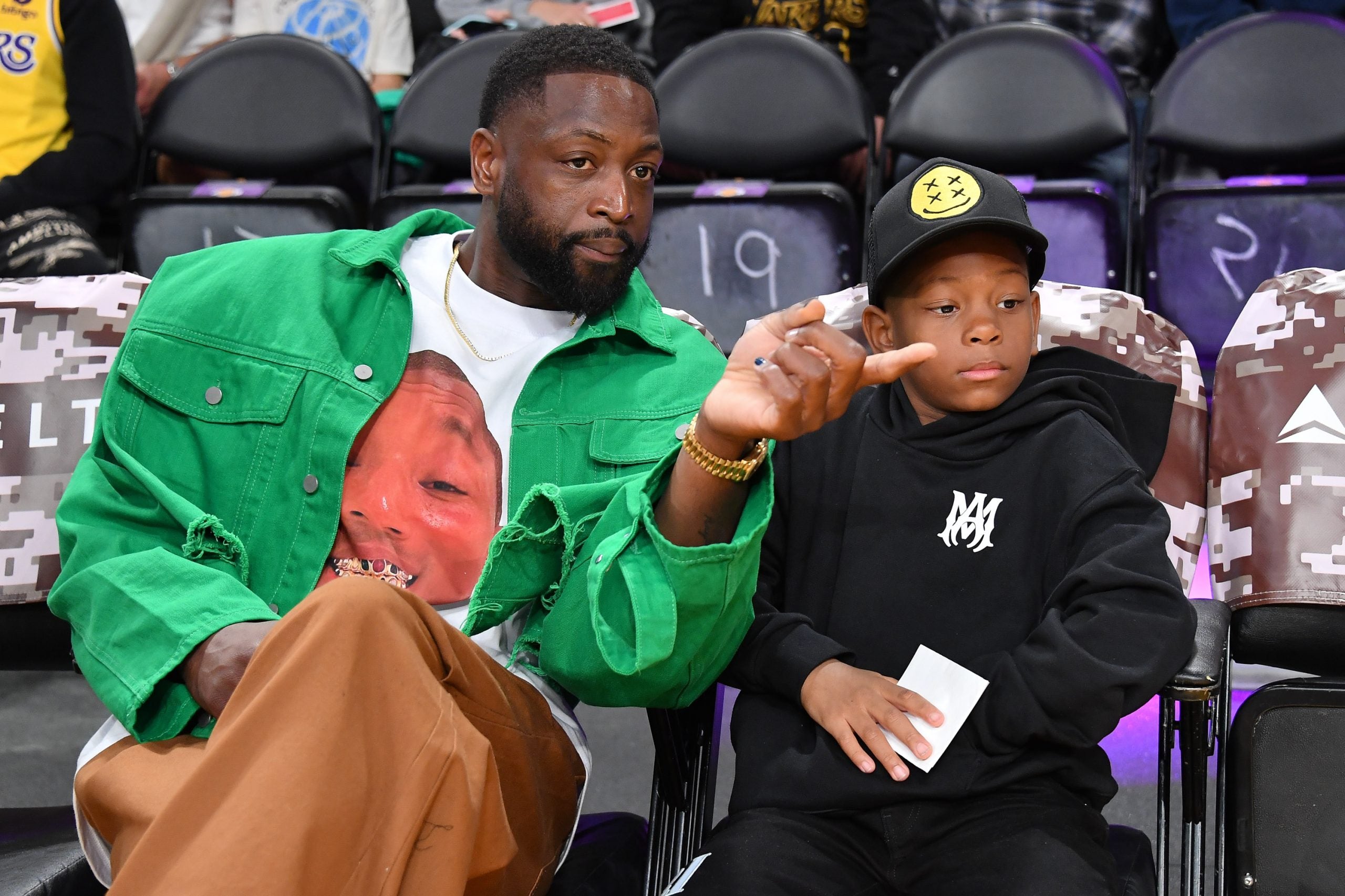 Dwyane Wade Steps Out With His Youngest Son Xavier For A Lakers Game