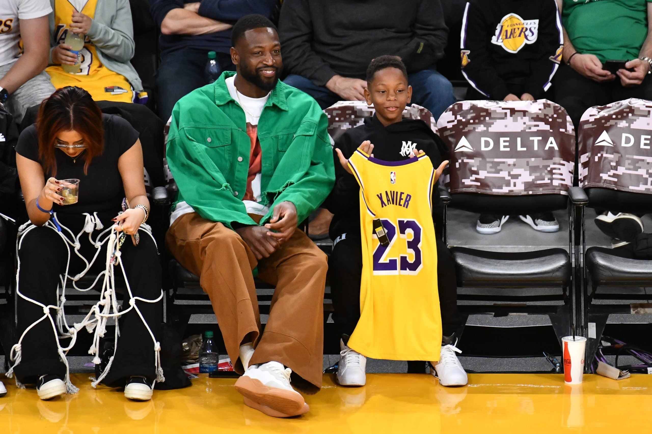 Dwyane Wade Steps Out With His Youngest Son Xavier For A Lakers Game