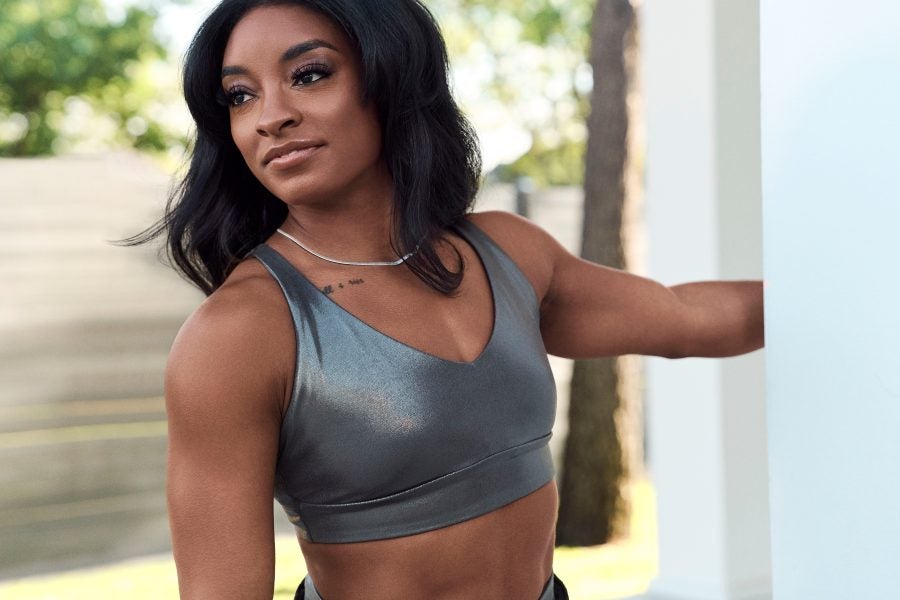 Essence Fashion Digest: Simone Biles Stars In Athleta's Holiday Campaign, Converse Releases Martine Ali Sneaker, And More