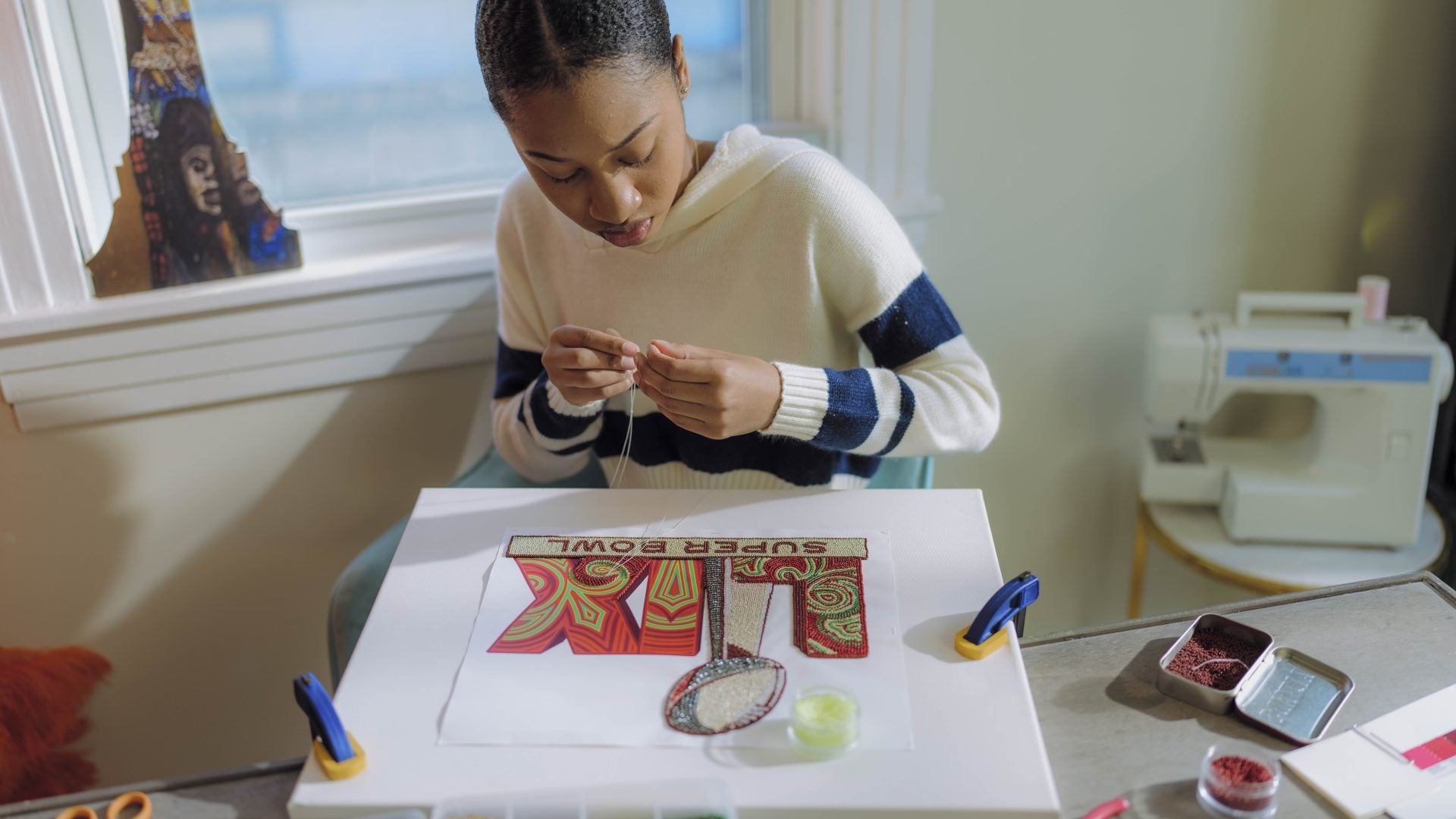 Meet 'Queen Tahj' Williams: The First Black Woman To Create The Logo And Theme Art For Super Bowl LIX